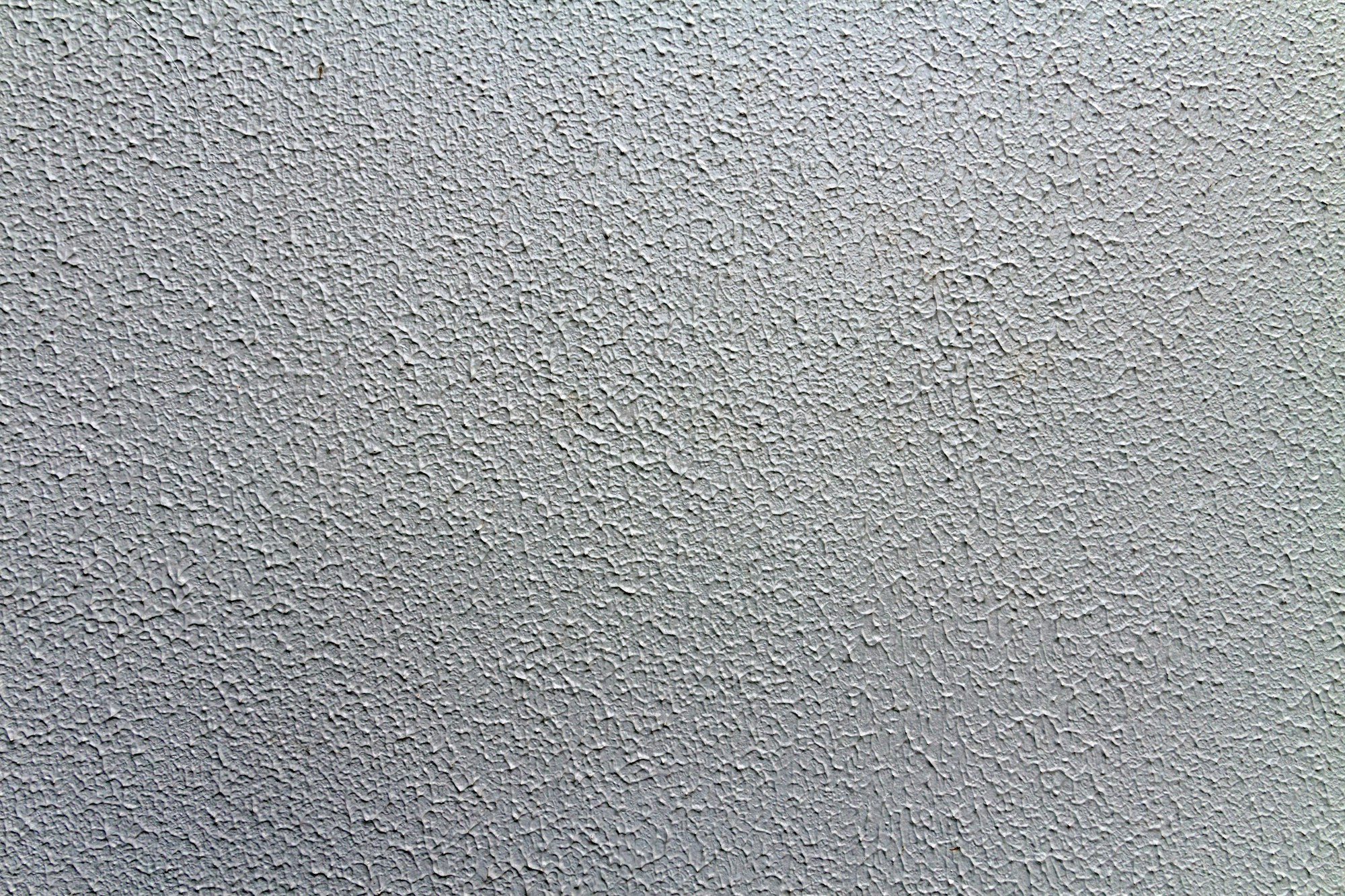 Closeup shot of a white popcorn ceiling surface