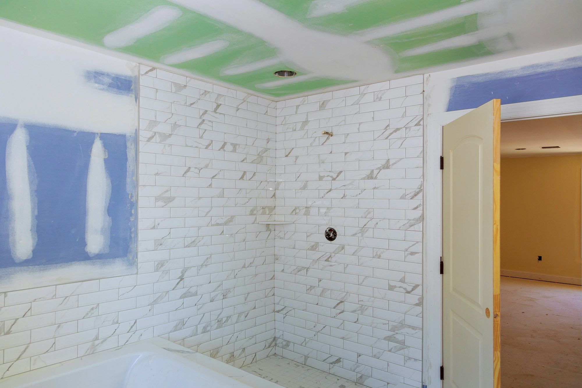 drywall tape bathroom interior with drywall completely installed